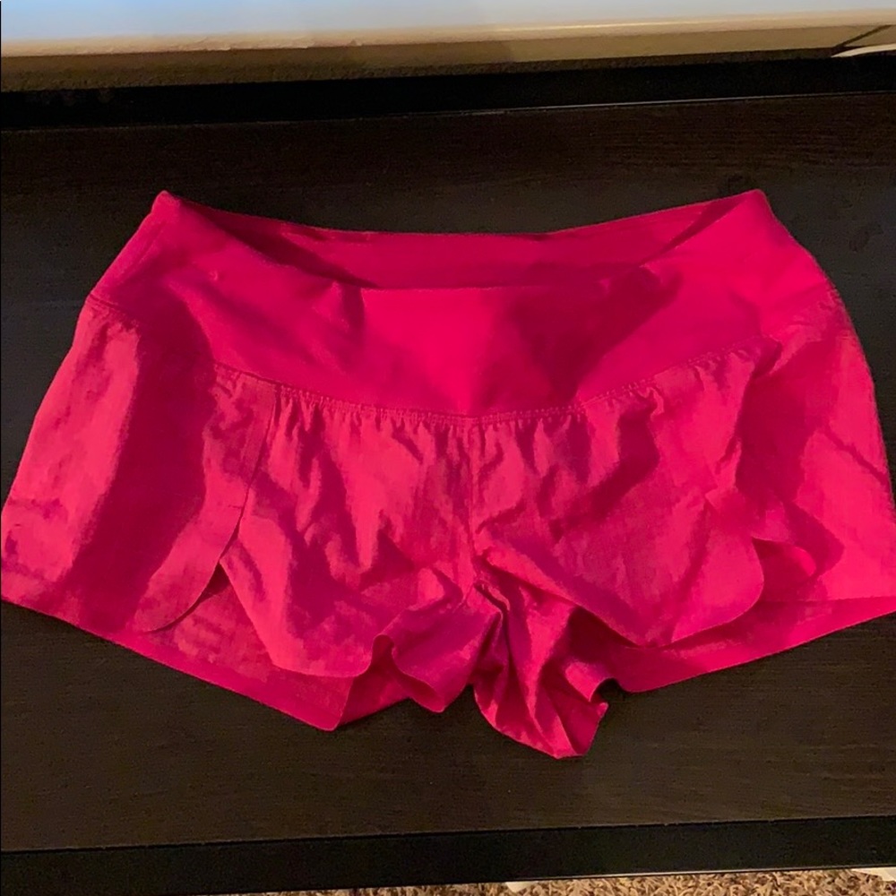 pink-purplish pink shorts